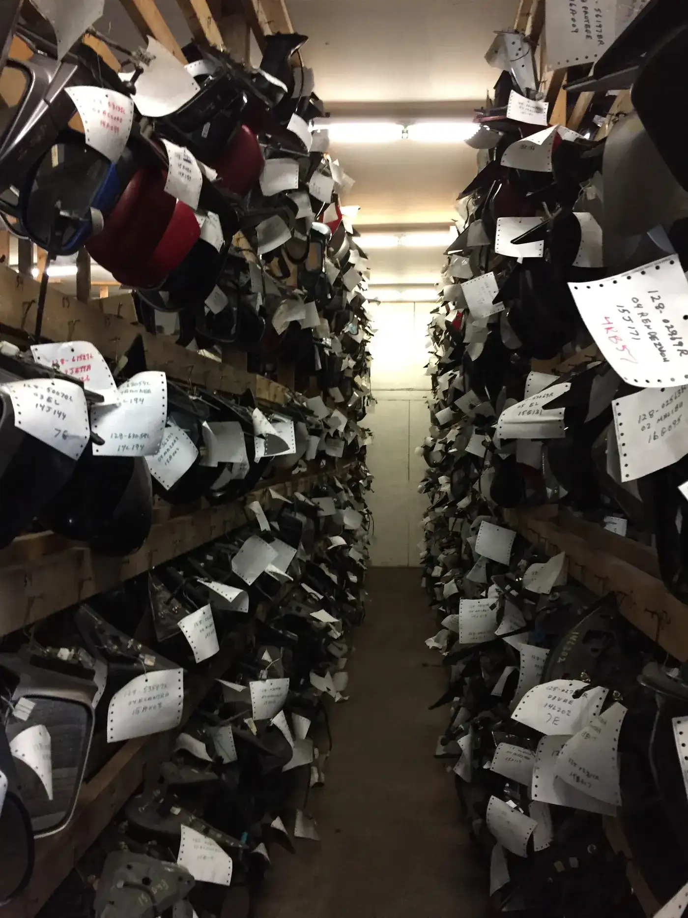 Shelves of tagged used auto parts in the G&L Auto parts warehouse